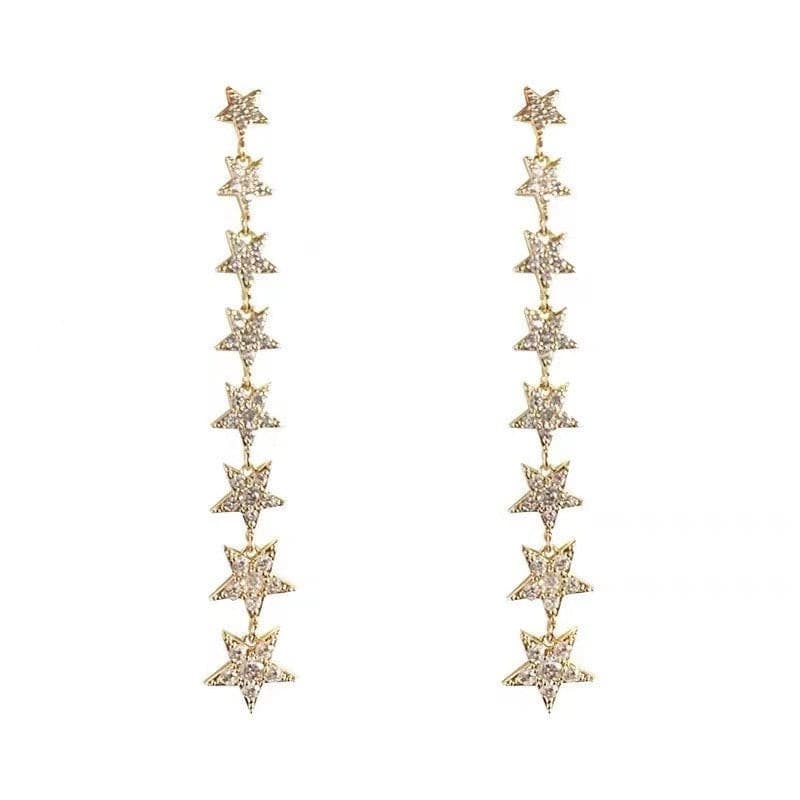 Gold Star Dangle Earrings.