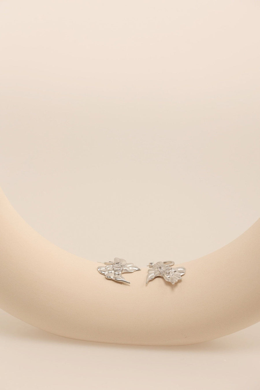 Silver Bow Dangle Earrings.